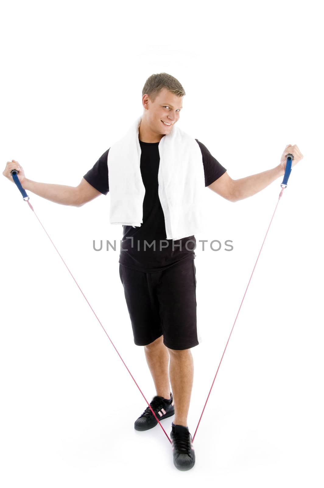 healthy man stretching exercise rope against white background