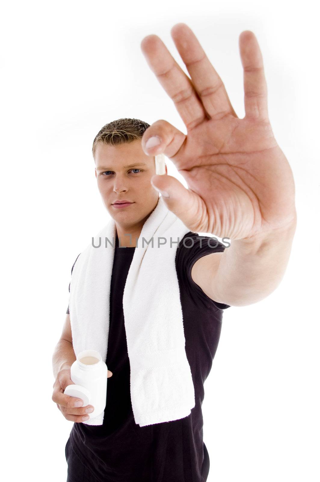 muscular male holding medicine on an isolated white background