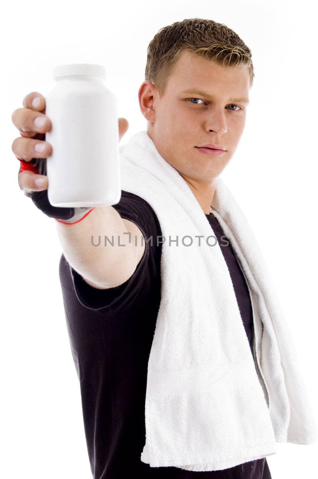 muscular male showing medicine bottle against white background
