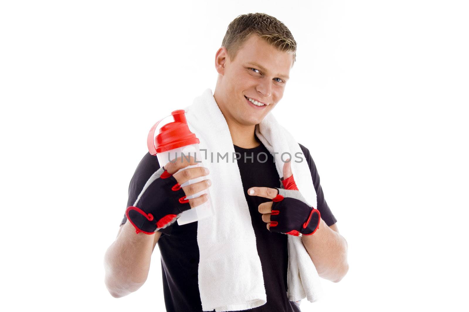 smiling muscular man pointing at the water bottle with white background