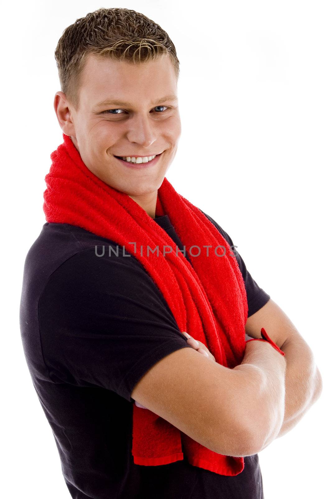 smiling muscular man with towel and crossed arm with white background