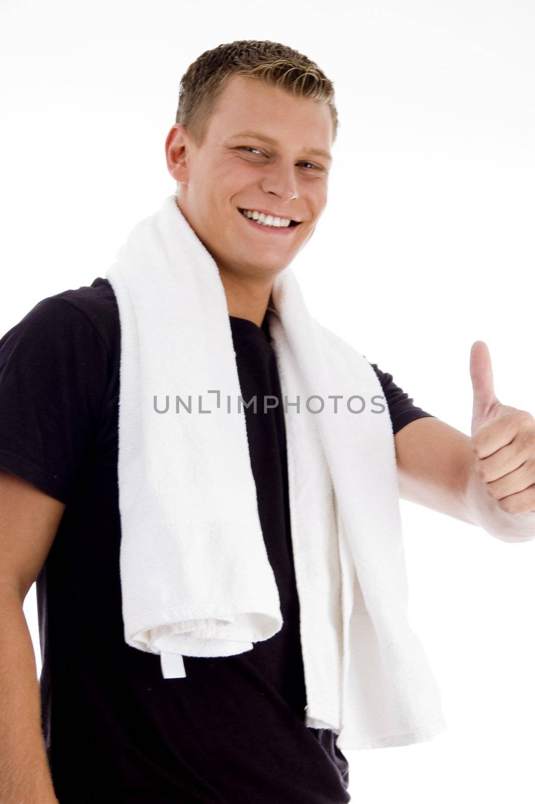 muscular male showing thumbs up on an isolated background