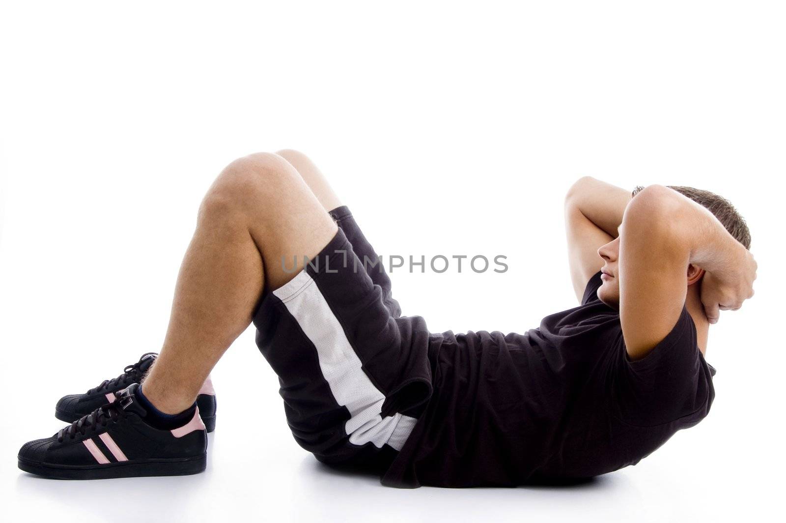 man doing crunches with white background