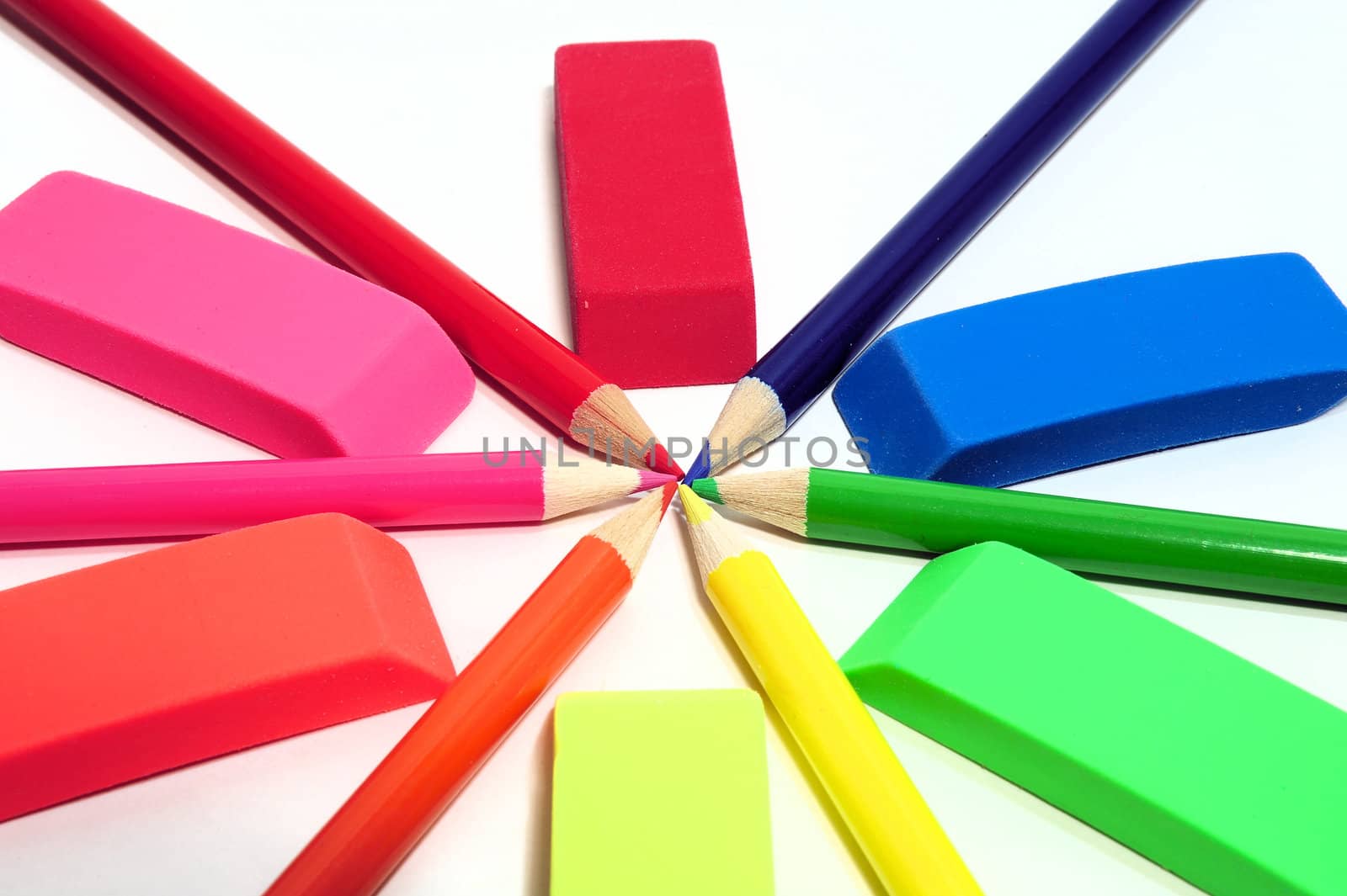 Colored pencils and erasers in various color shades