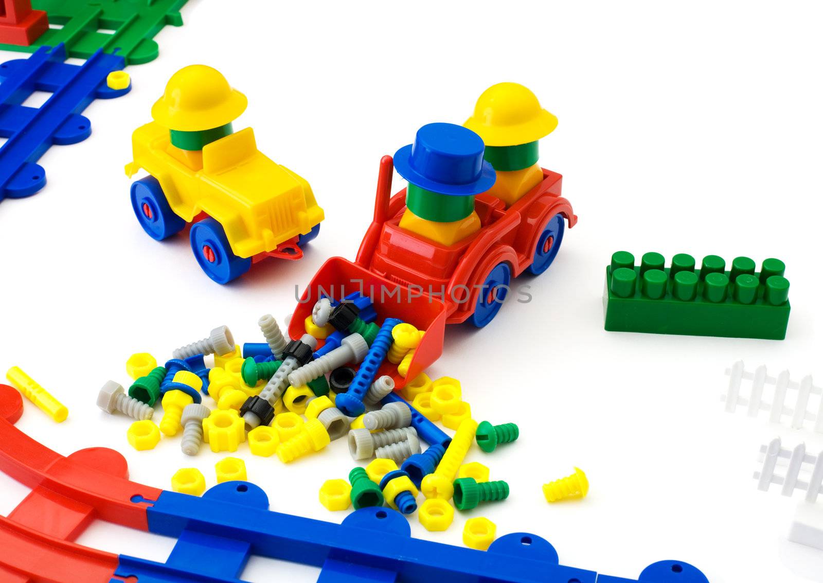 Toy plastic machines on the white background