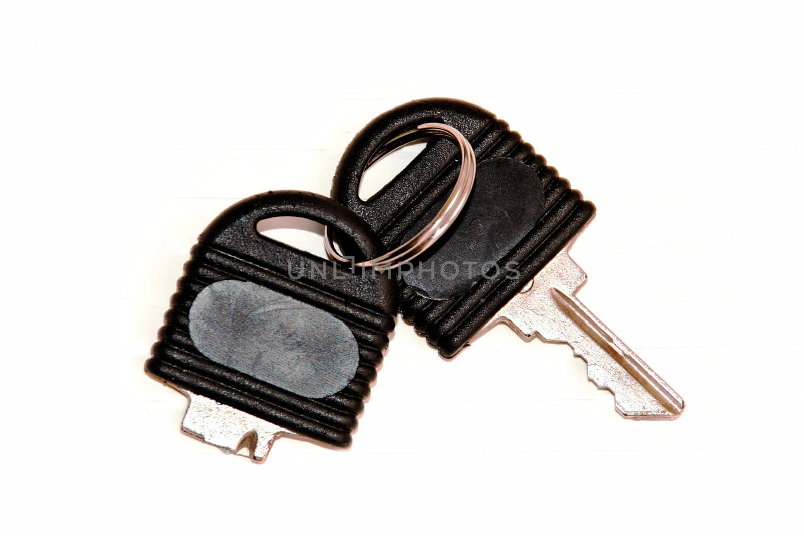 broken black office key isolation over white close up