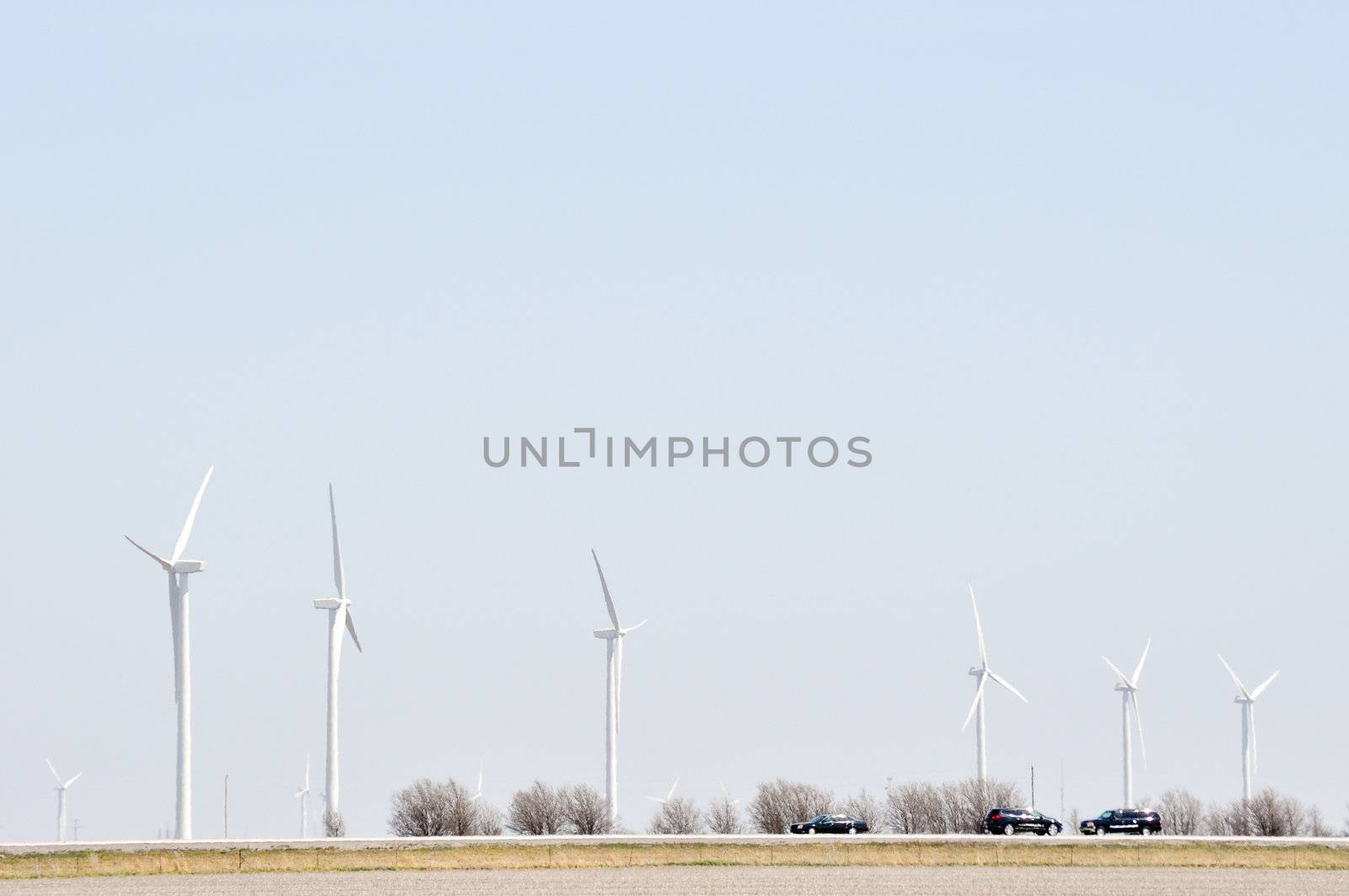 Turbines Spin Over The Road by RefocusPhoto