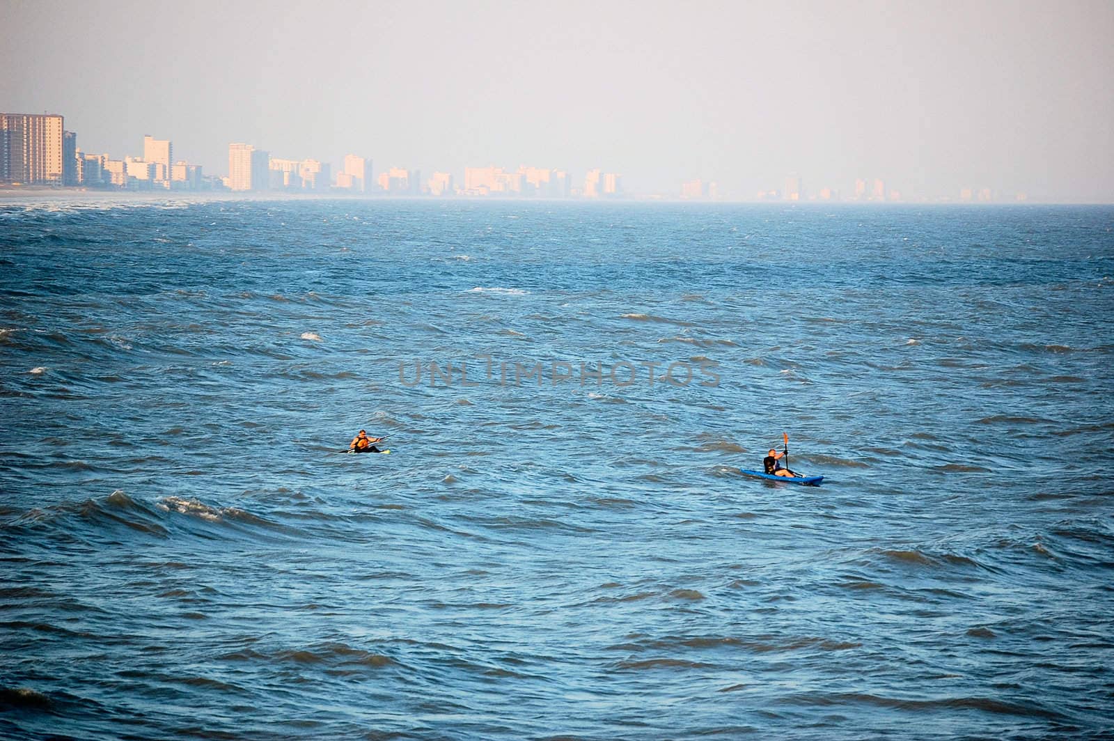 Two Kayakers on the Coast by RefocusPhoto