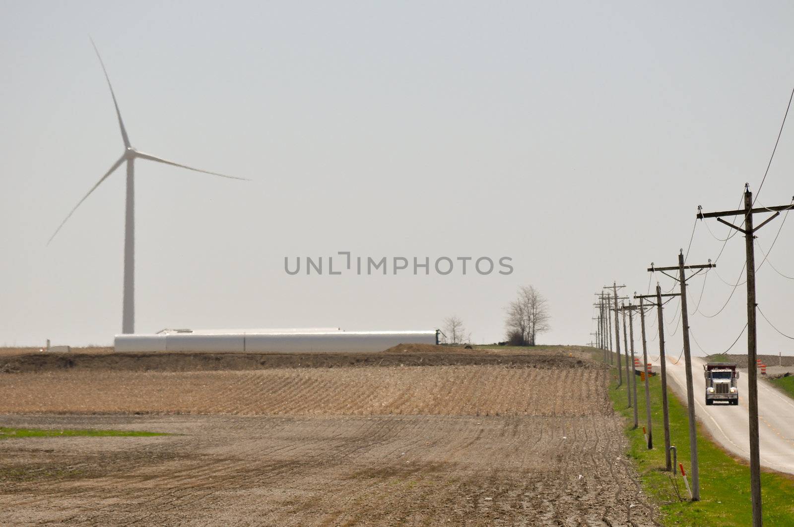 Truck rolls while turbine spins by RefocusPhoto