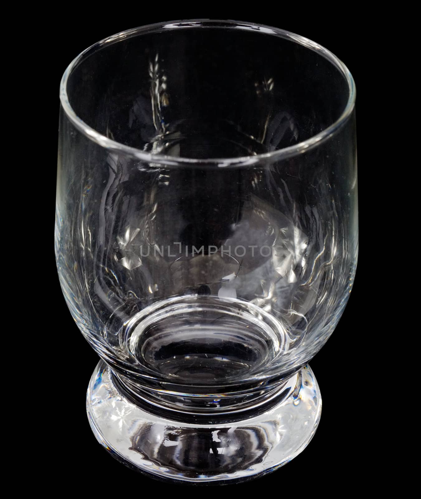 Glass empty goblet on the black background