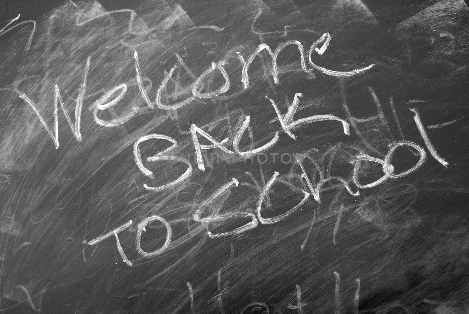 Back to school is written on a chalkboard.