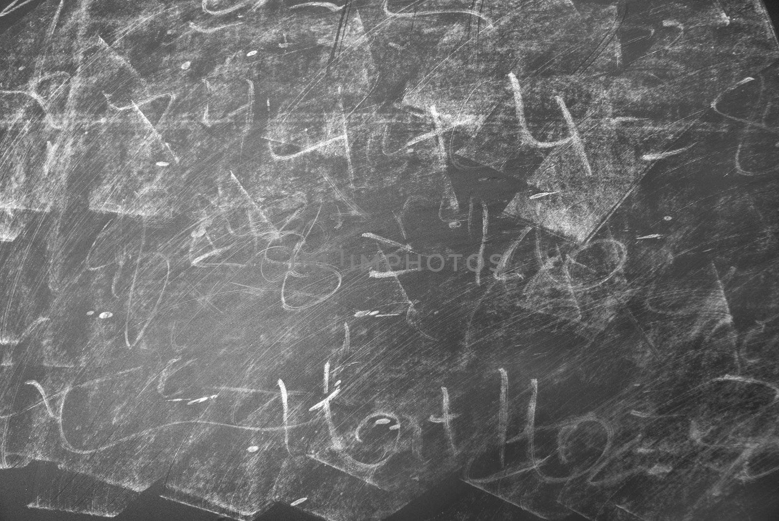 A macro shot of a messy chalkboard.