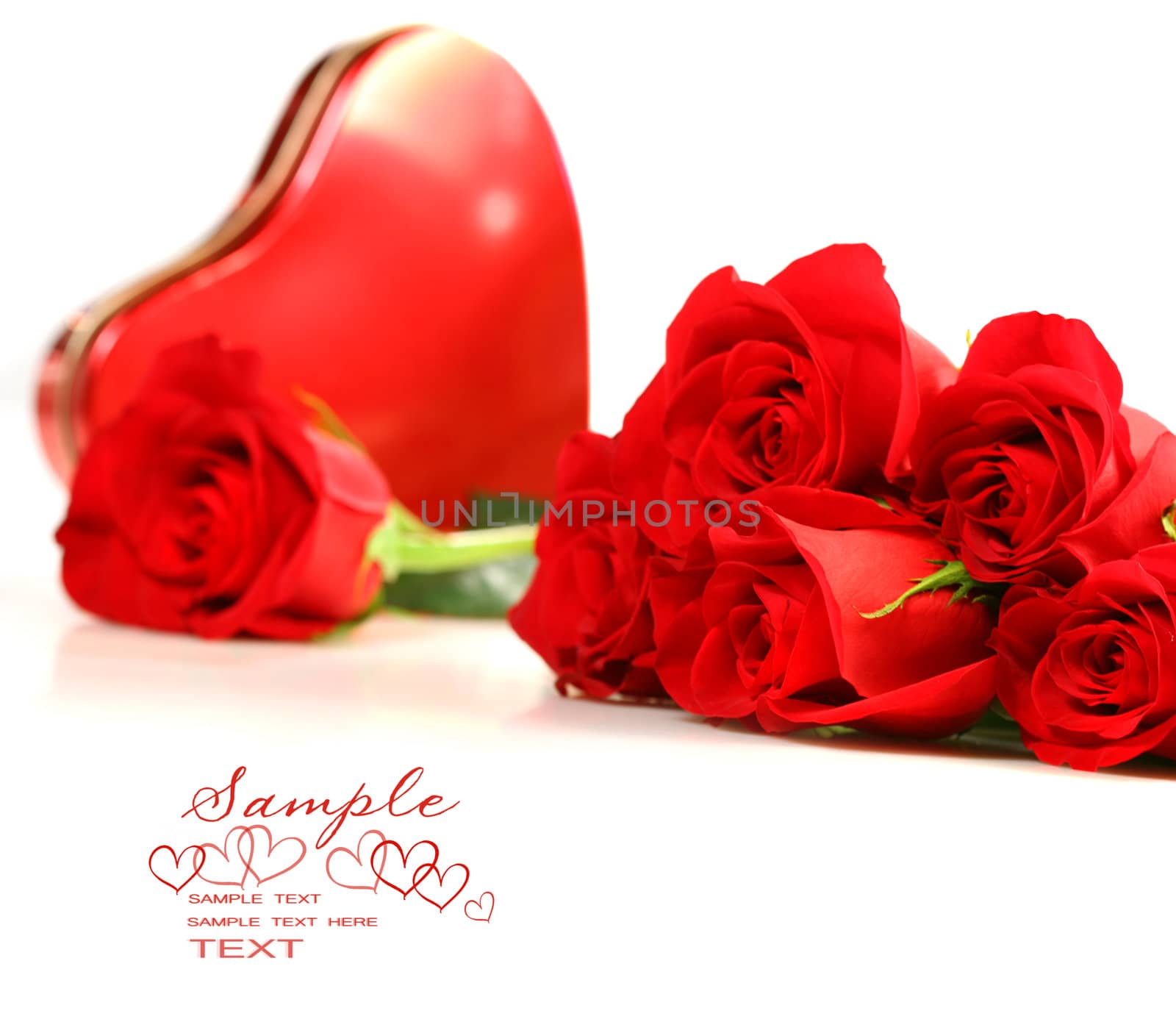 Red roses with boxof chocolate on white background