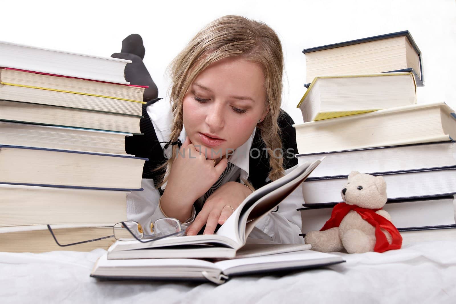 schoolgirl or student reading books by amaxim