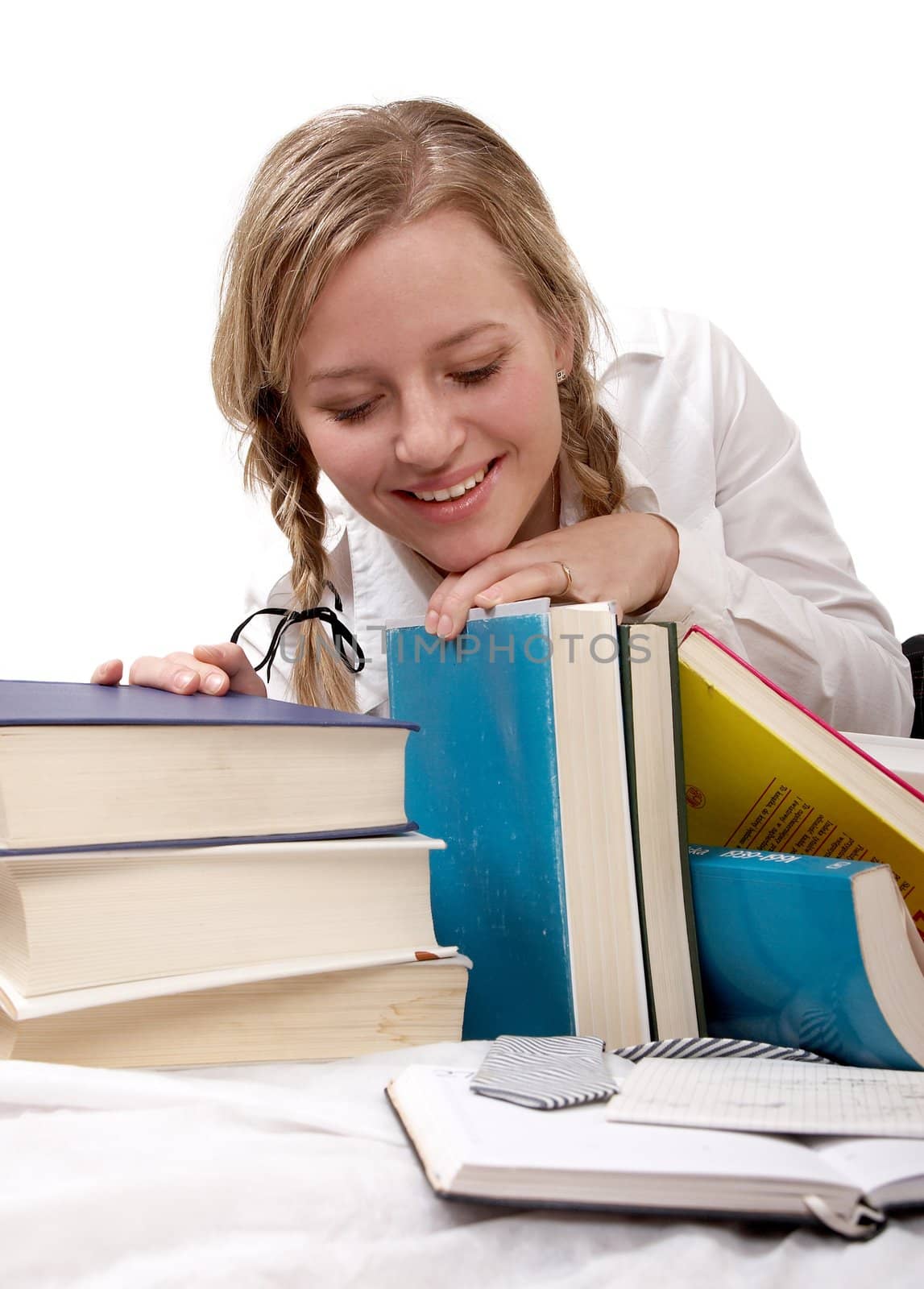 schoolgirl or student looking at books by amaxim