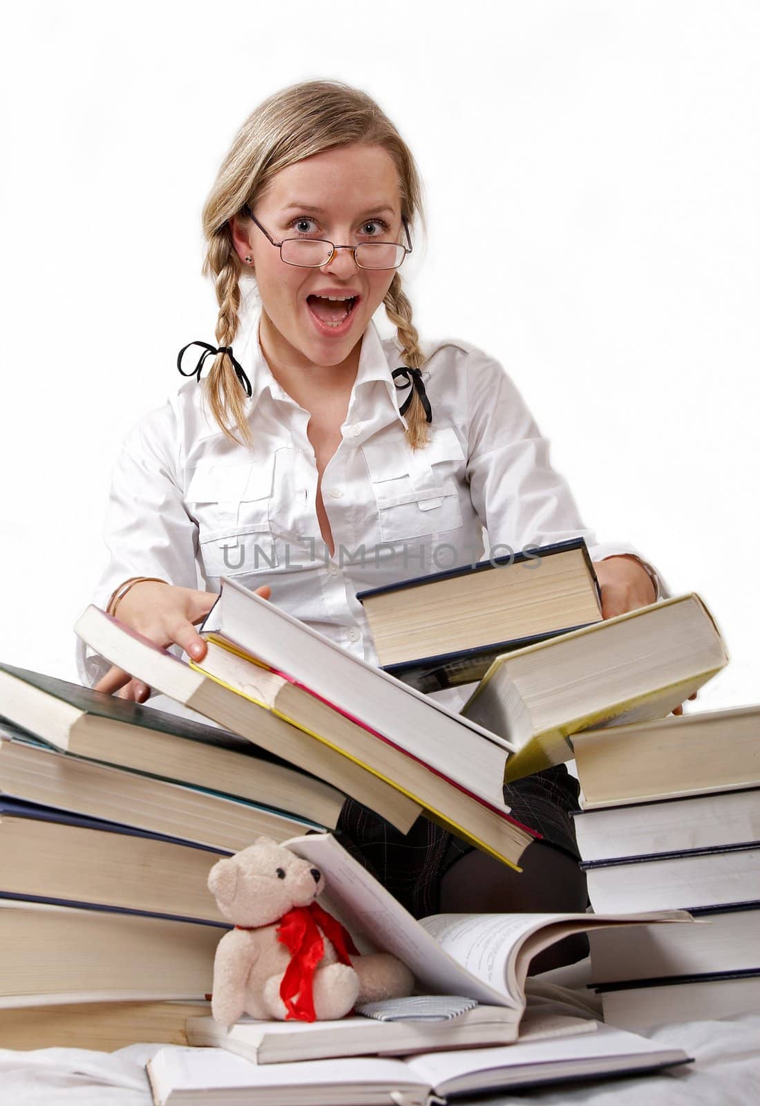 Schoolgirl or student and rolling-over books. She has glasses on her nose. There is a mess but she is satisfied, since she is ended to teach. Isolated on white.