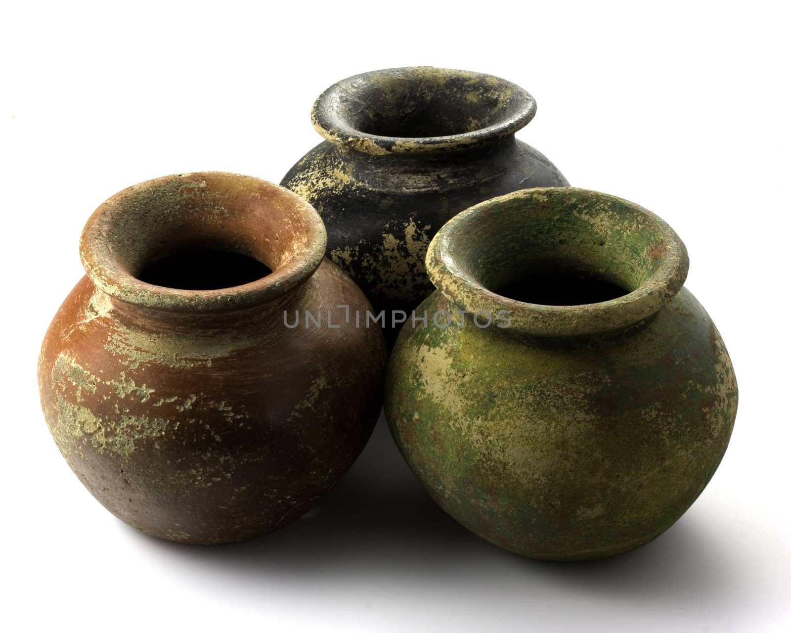 three small plant clay pots (mass produced planters) with rough, red, green, black and yellow finish on white background