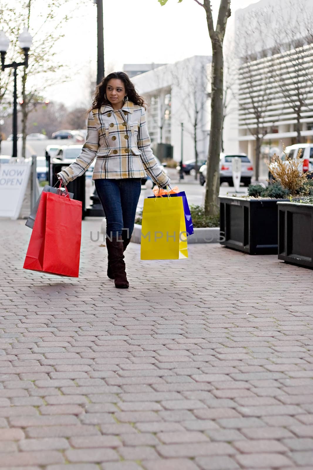 An attractive girl out shopping in the city.