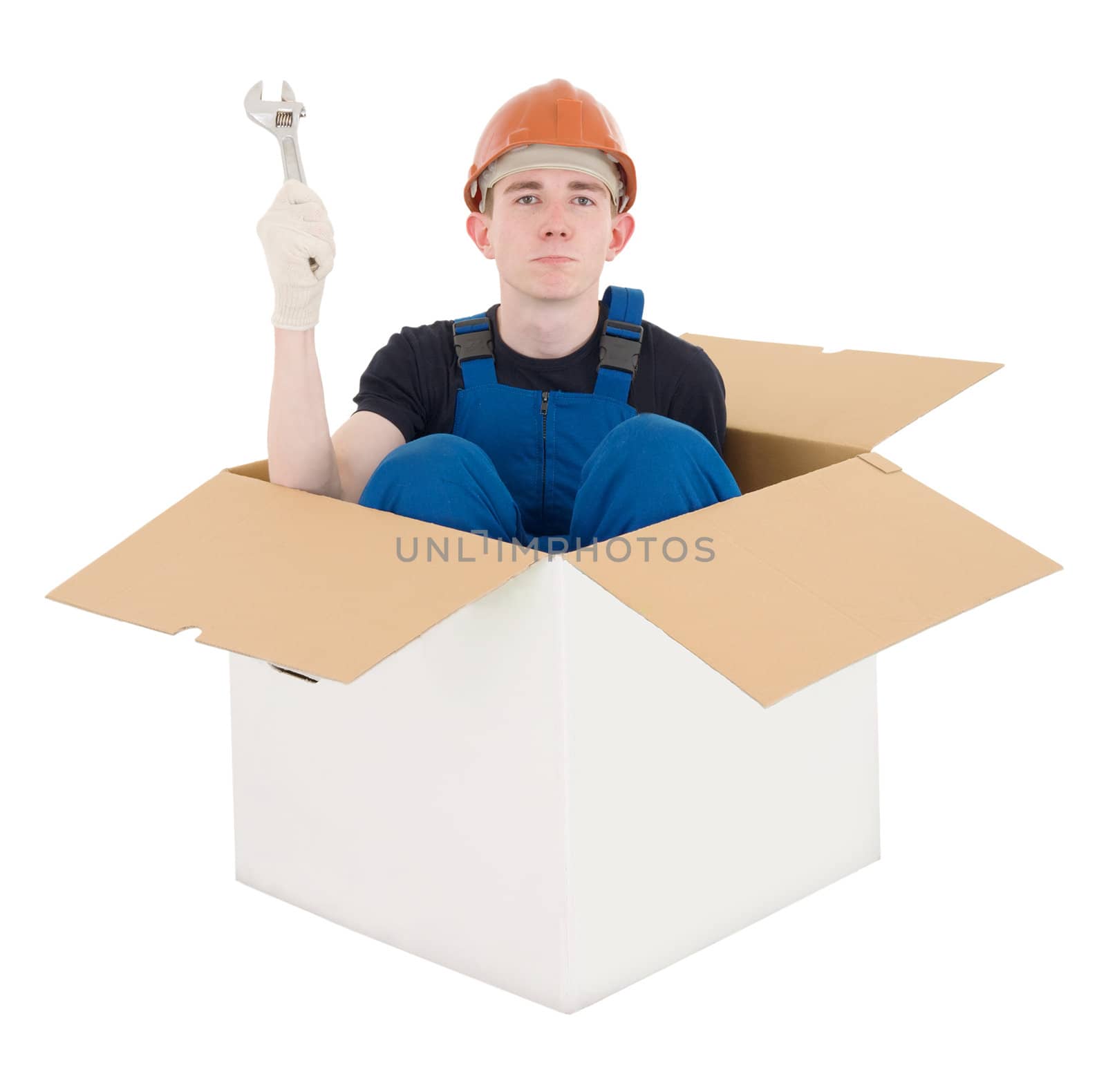 Man in carton with wrenches in hand