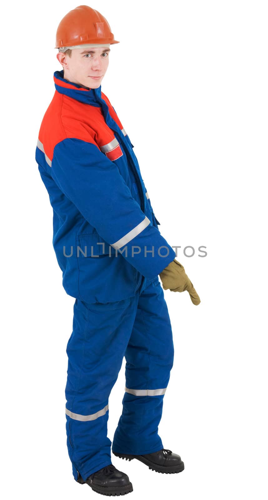 Young man in overalls of the adjuster, helmet and glove