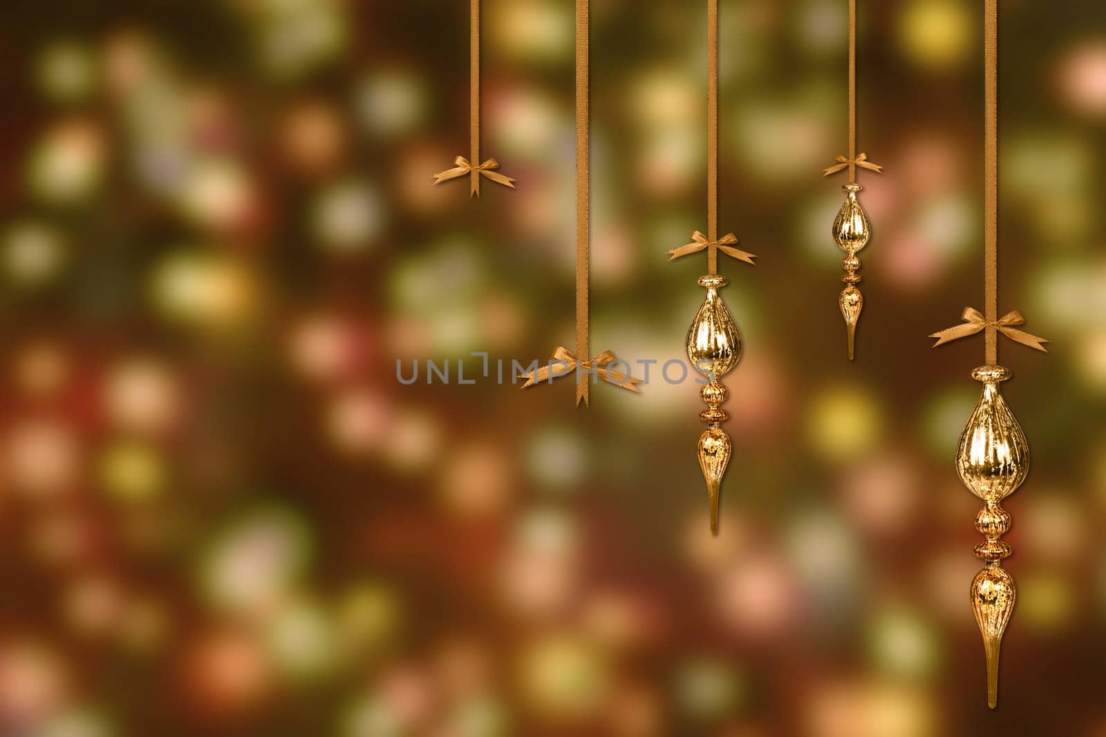 Gold Christmas Ornaments on a Blurry Lit Background by tobkatrina