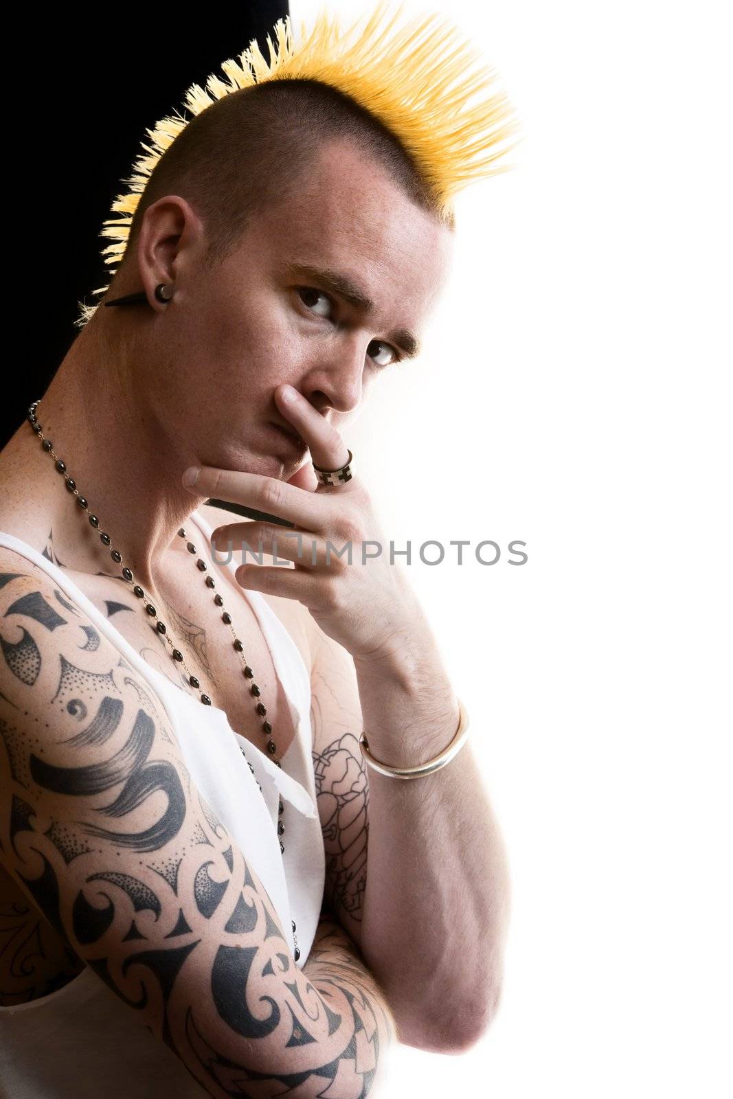 Man with a tall yellow Mohawk hairstyle
