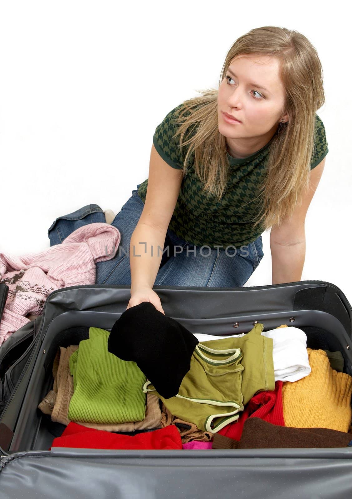 girl is packing clothes by amaxim