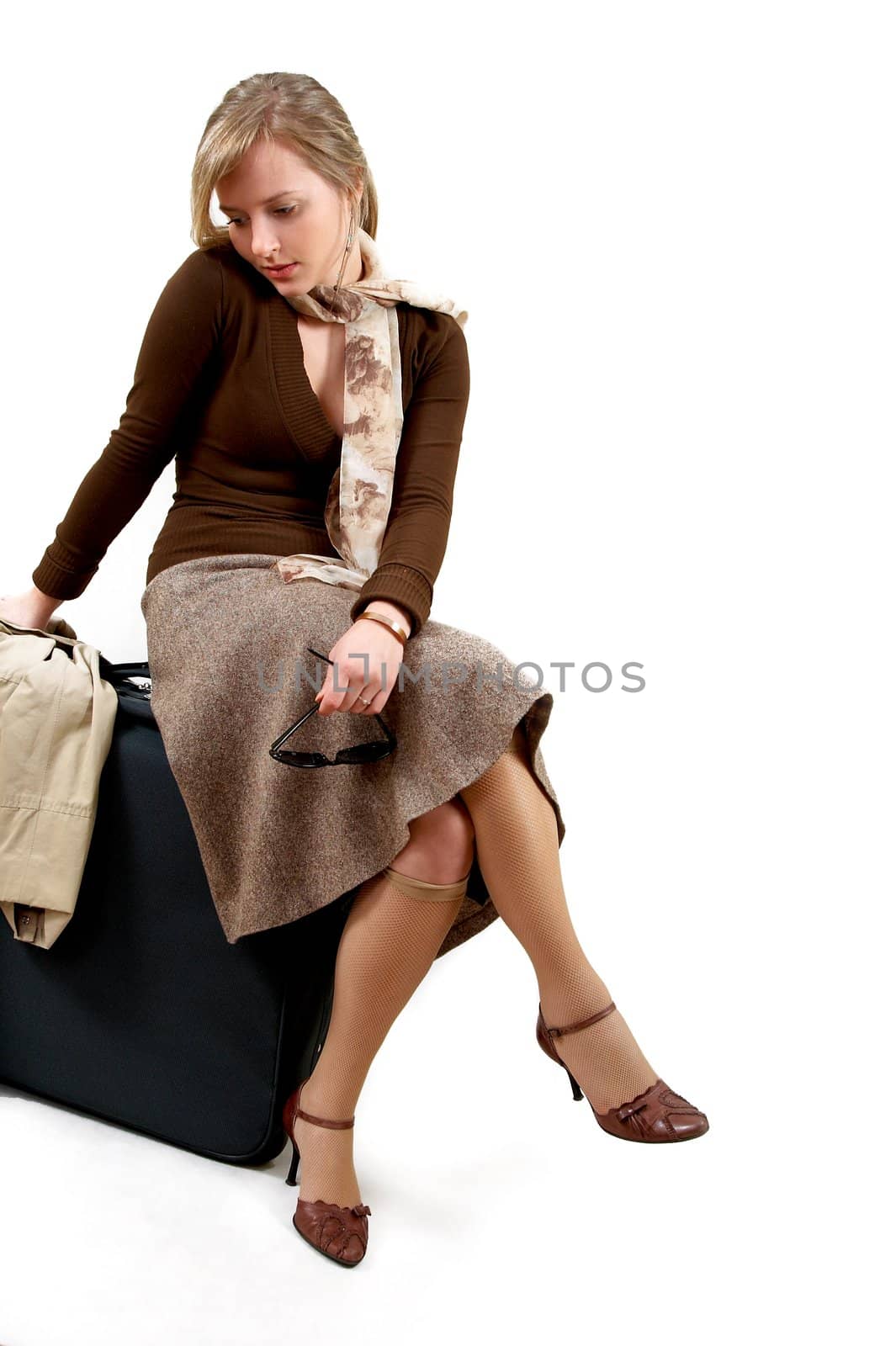 beauty woman with huge bag is siting, separate on white