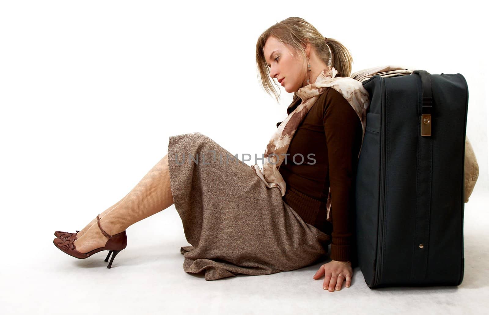 beauty woman with huge bag is siting, separate on white