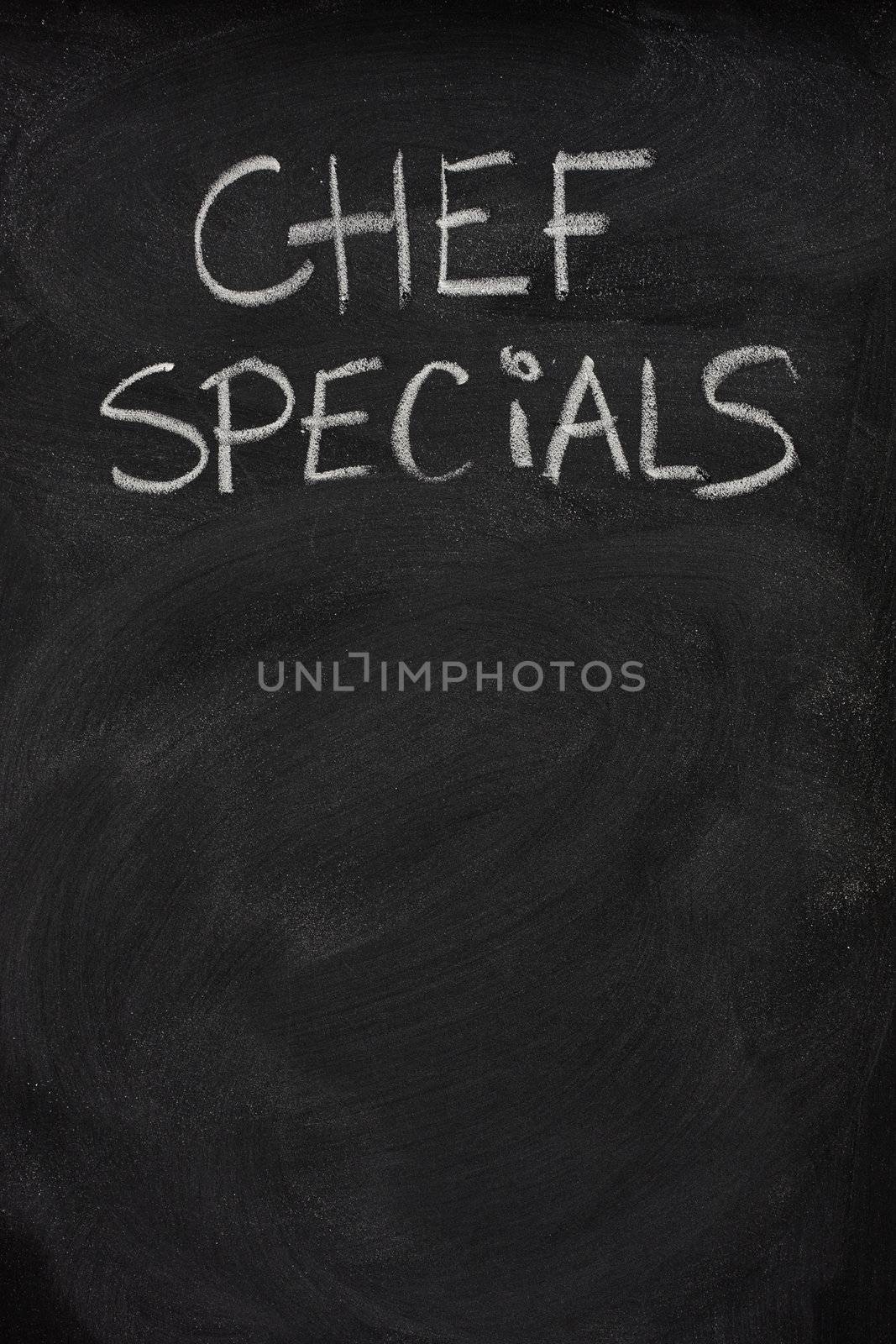 chef specials title handwritten with white chalk on blackboard, copy space below