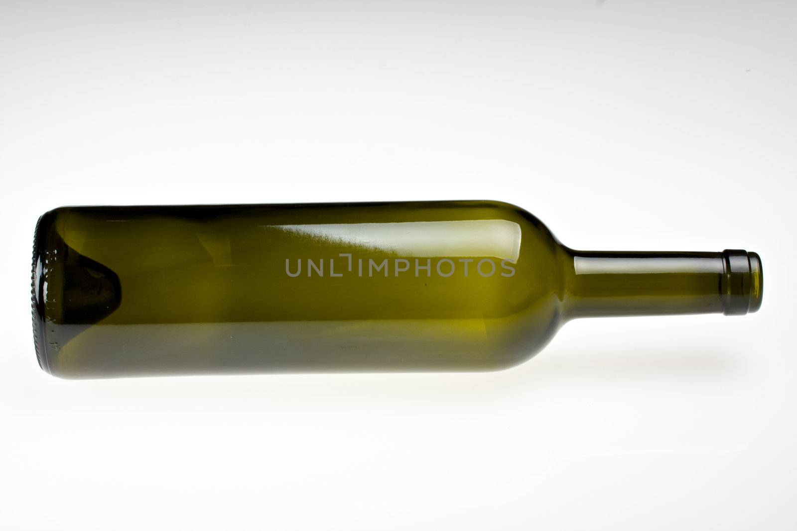 empty wine bottle lying on grey background
