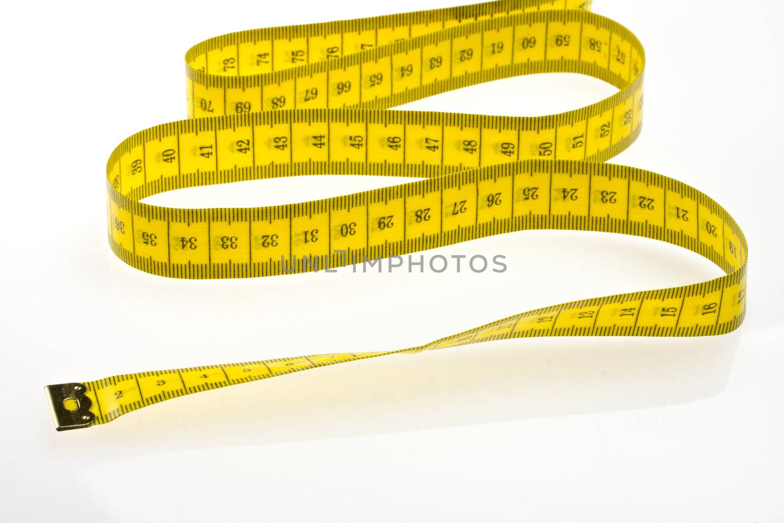 yellow measuring tape isolated on white background by bernjuer