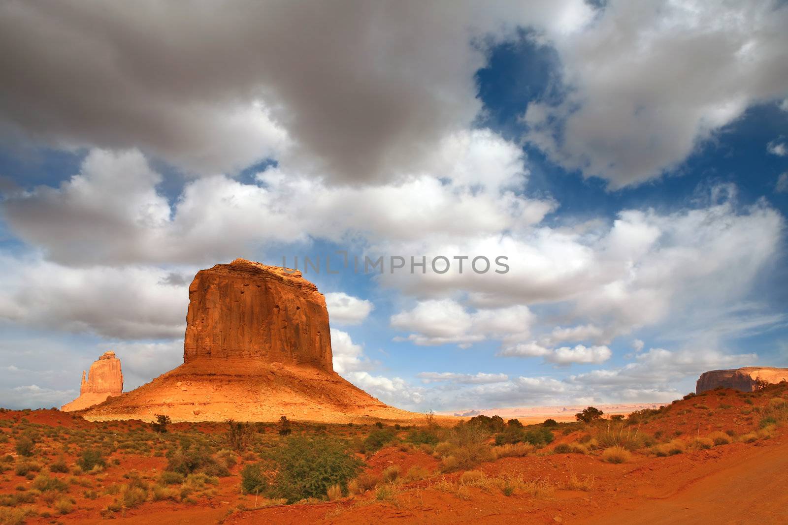 Monument Valley Giants With Cloud Cast Shade  by tobkatrina