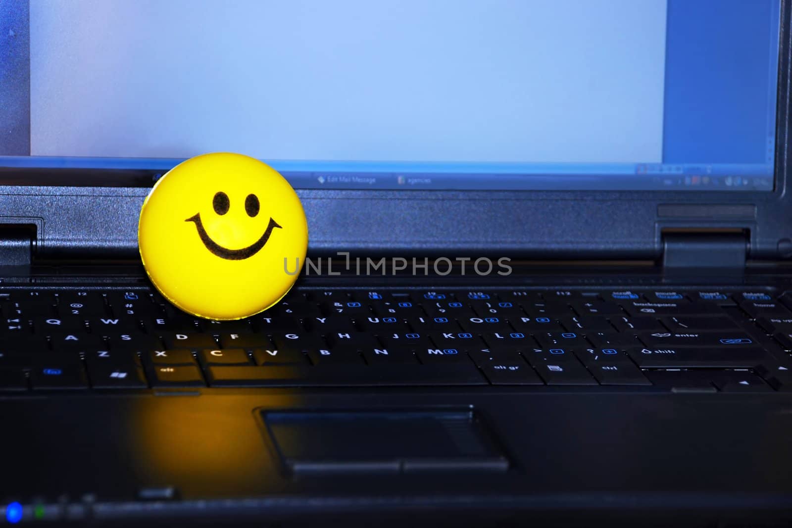 Smiley on laptop by simply