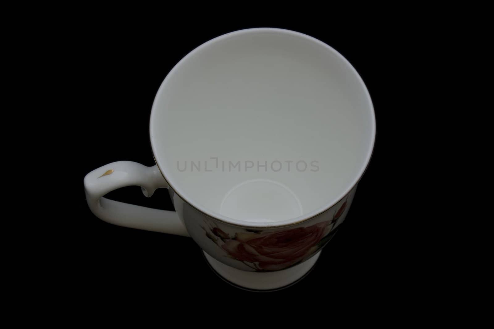 white cup isolated on black