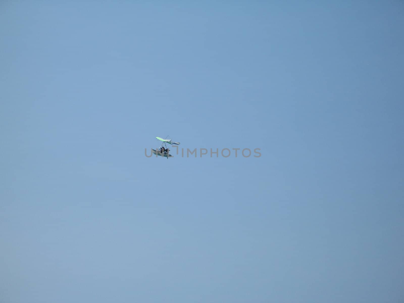 glider in the blue sky