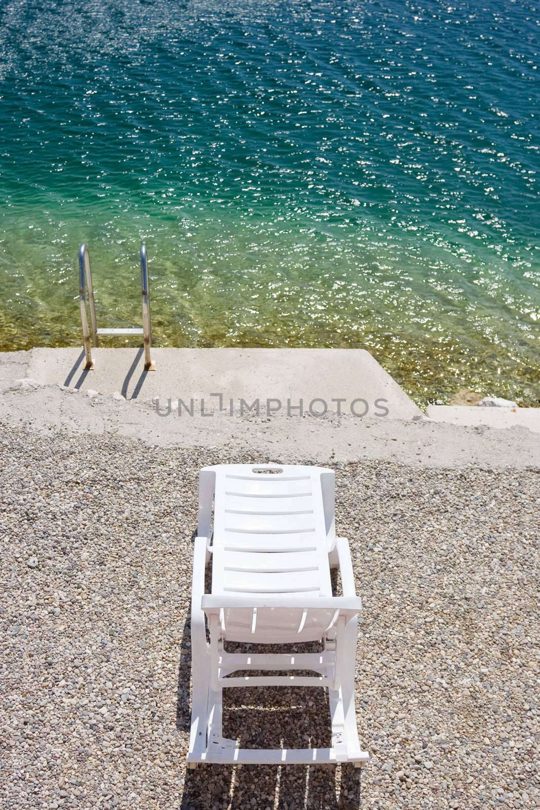 Beach chair over Adriatic sea