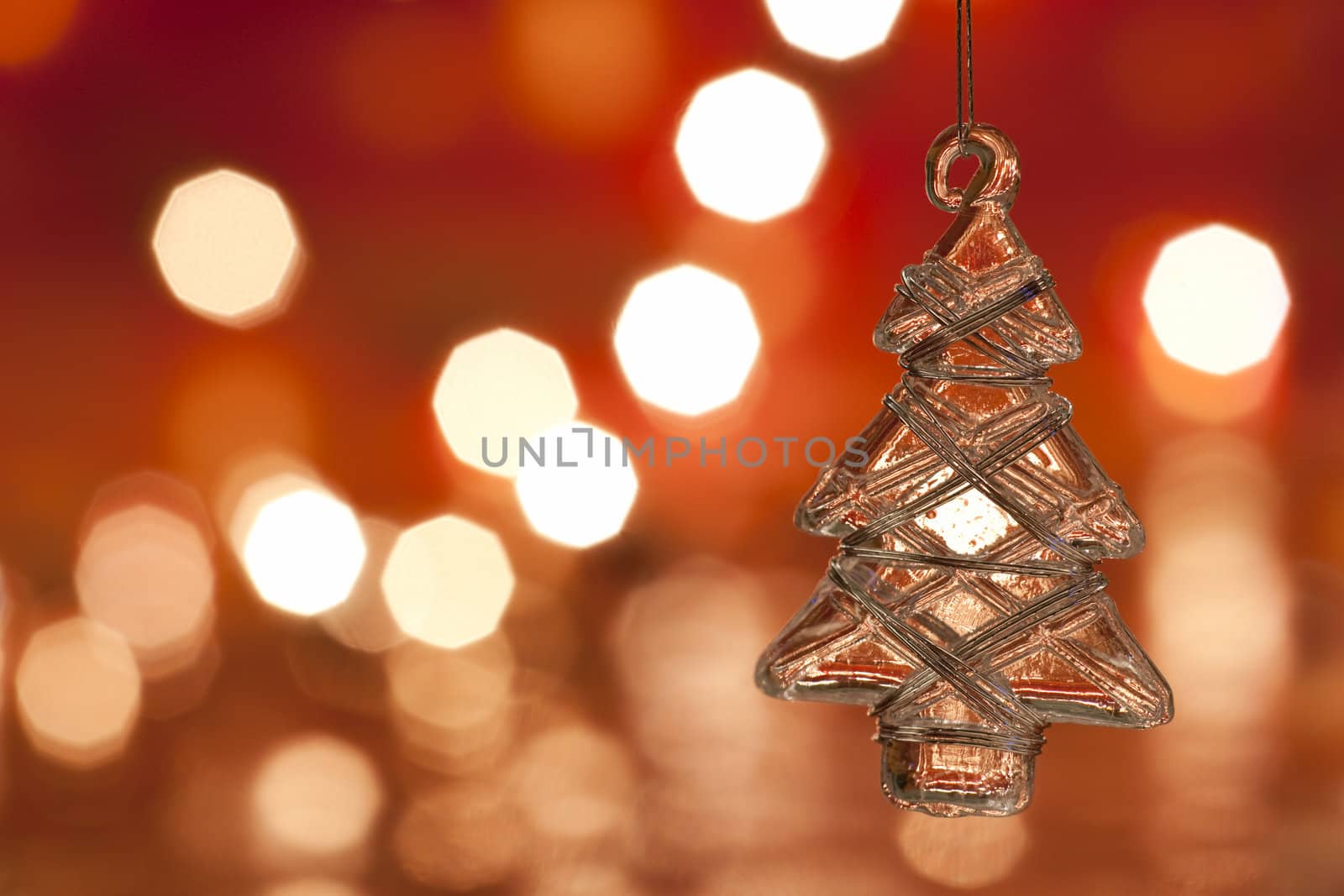 Christmas decoration - glass christmas tree. Blurred lights background. aRGB.