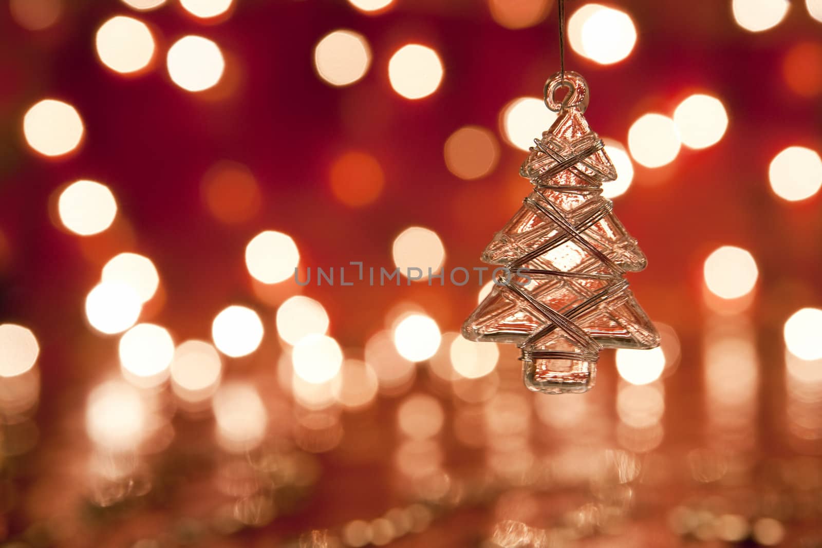 Christmas decoration - glass christmas tree. Blurred lights background. aRGB.