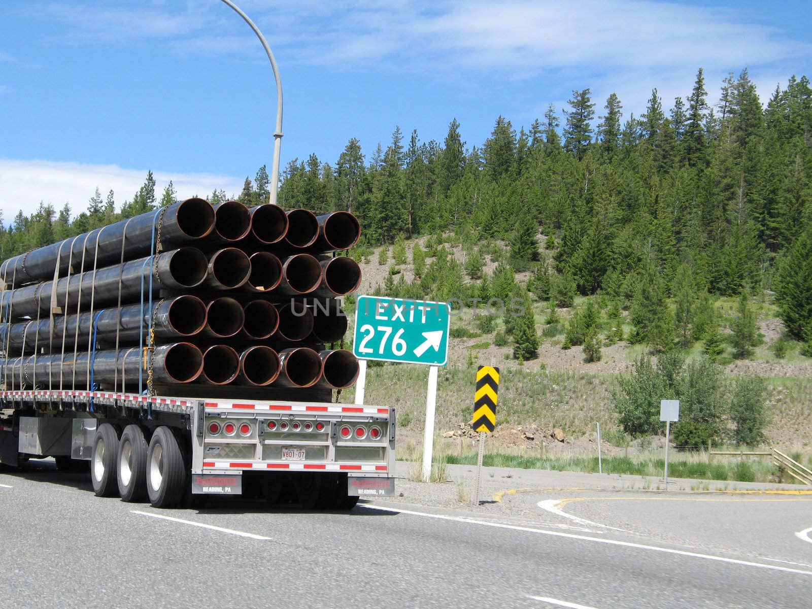 van transporting metal tubes