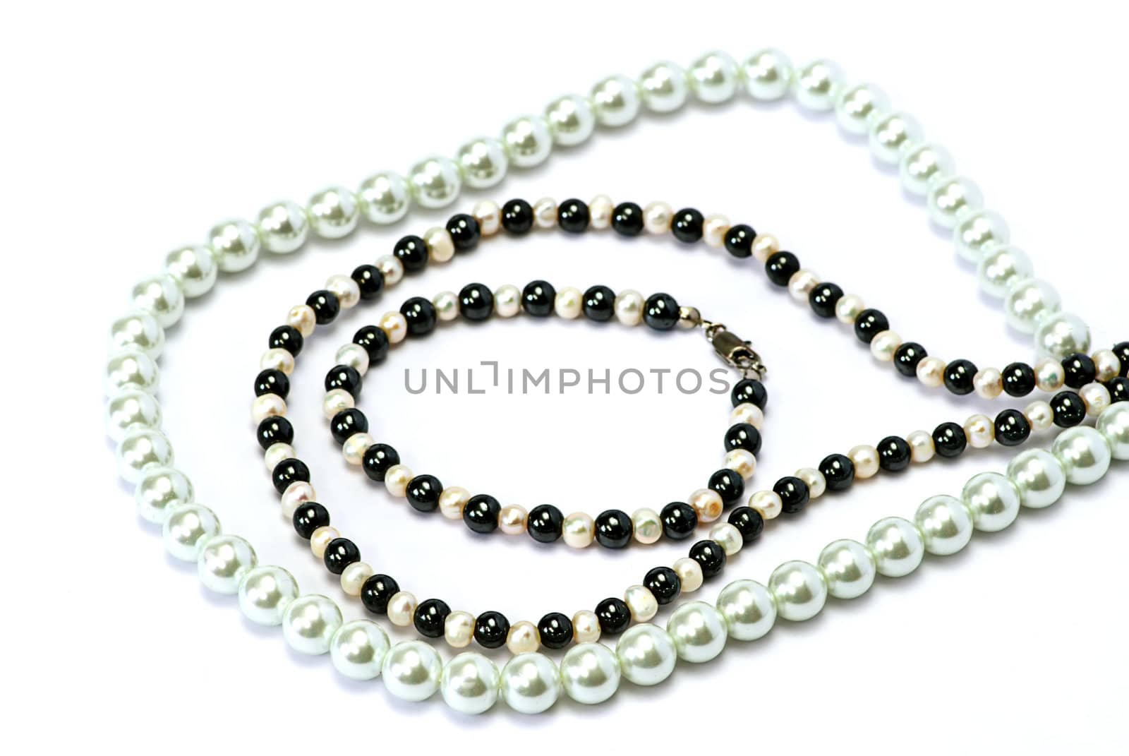 pearls and red pocket on white isolated
