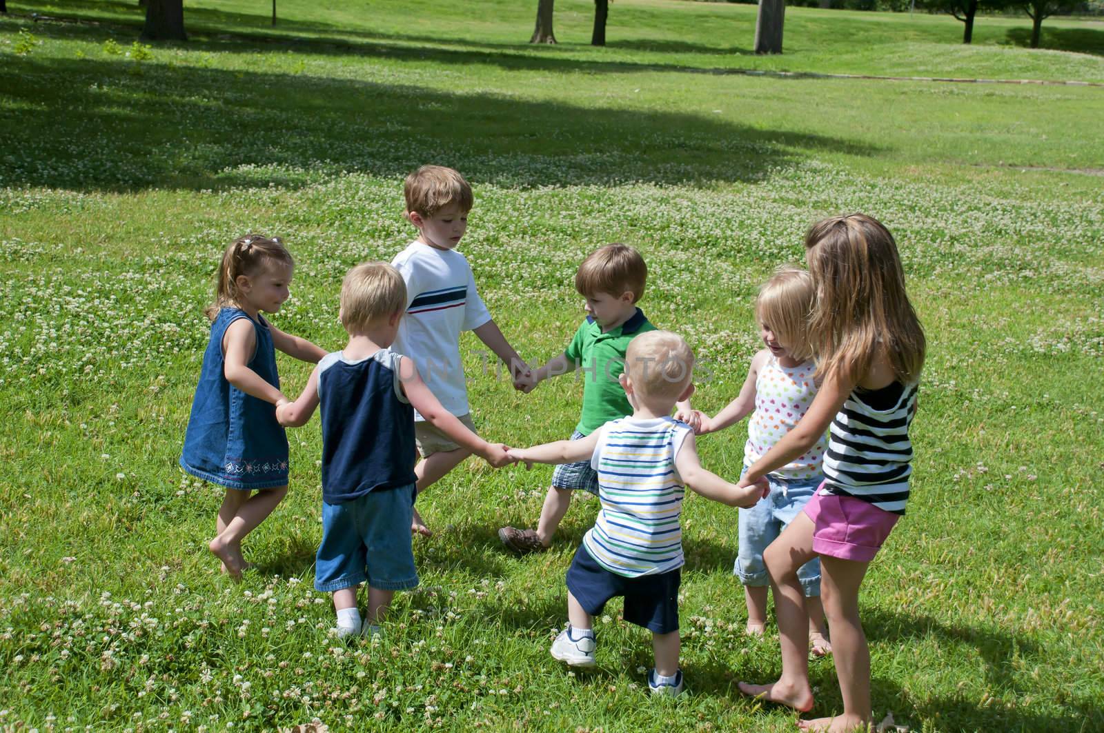 young children in the park playing and having fun