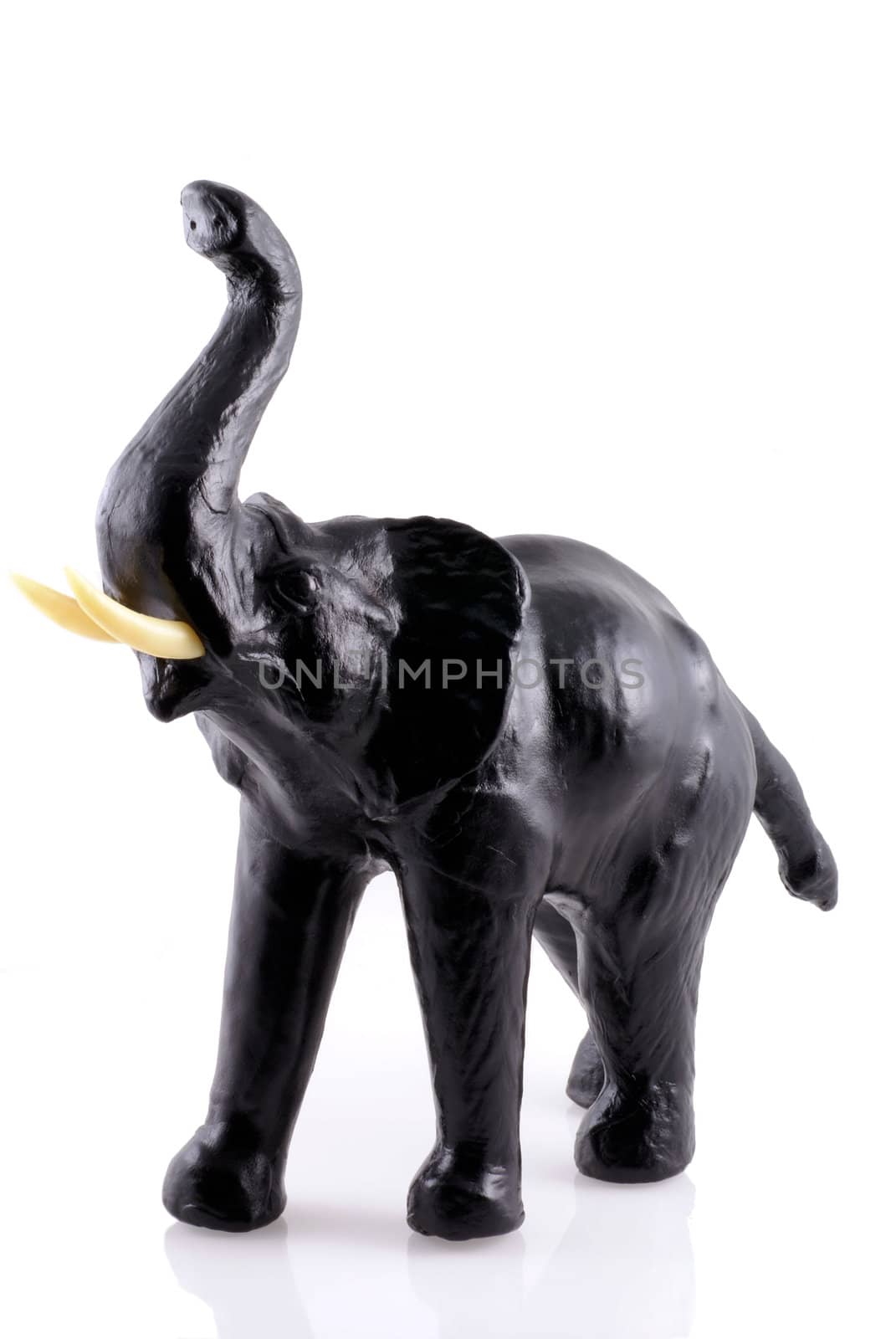 Little black wooden elephant, isolated on white.