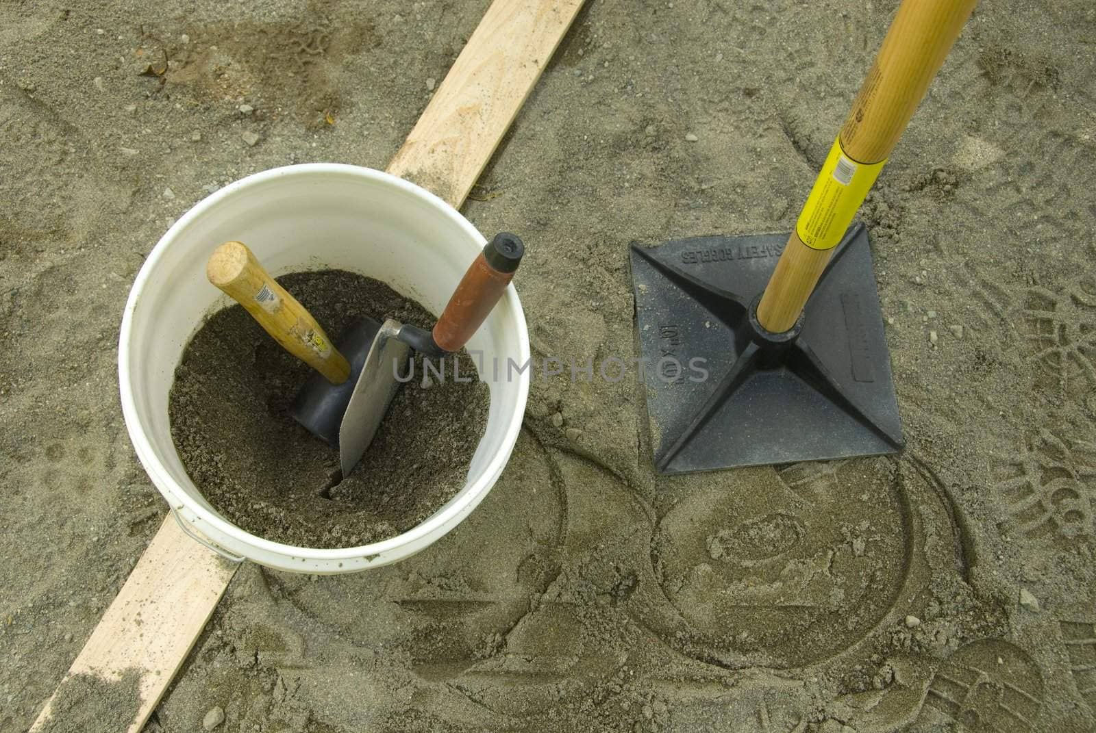 bucket with sand and toold for brick patio building by rongreer