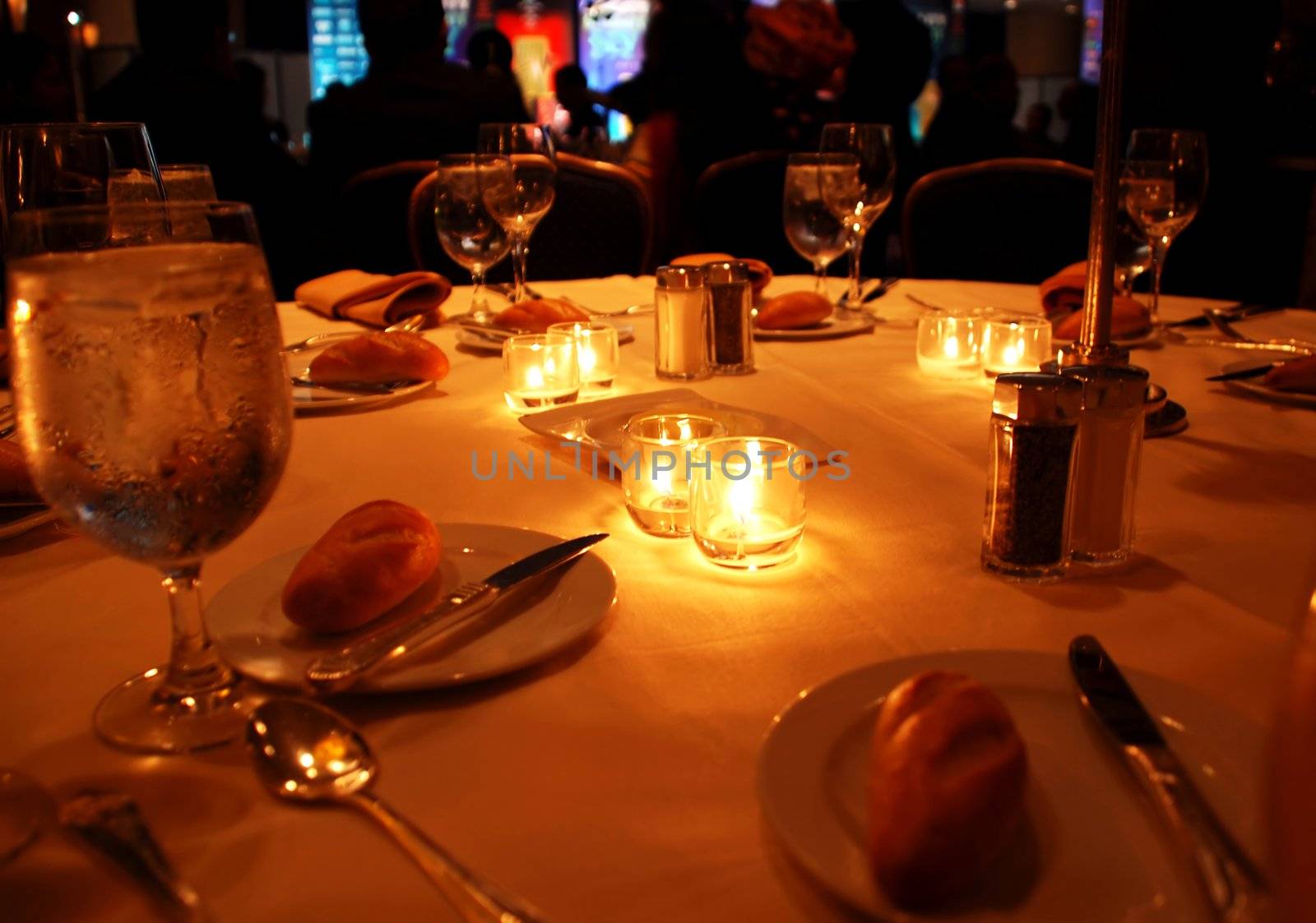 round table appointments with candles on gala dinner in restaurant