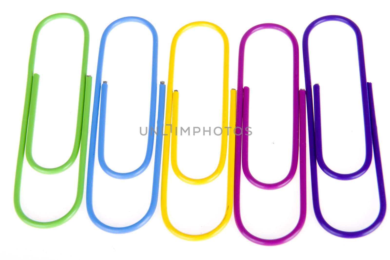 five colorful paperclips on a white background