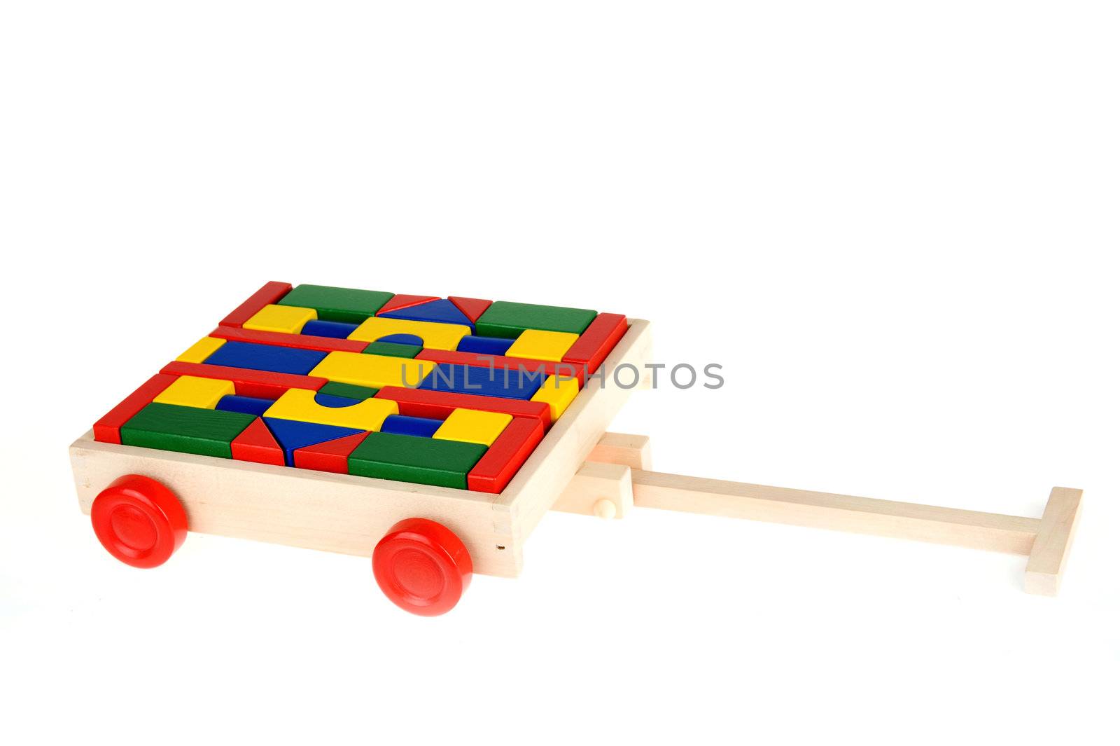 colorful building blocks in a trolley on a white background