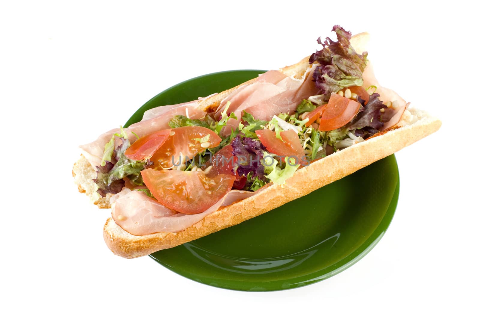 a fresh and healthy baguette with ham and vegetables