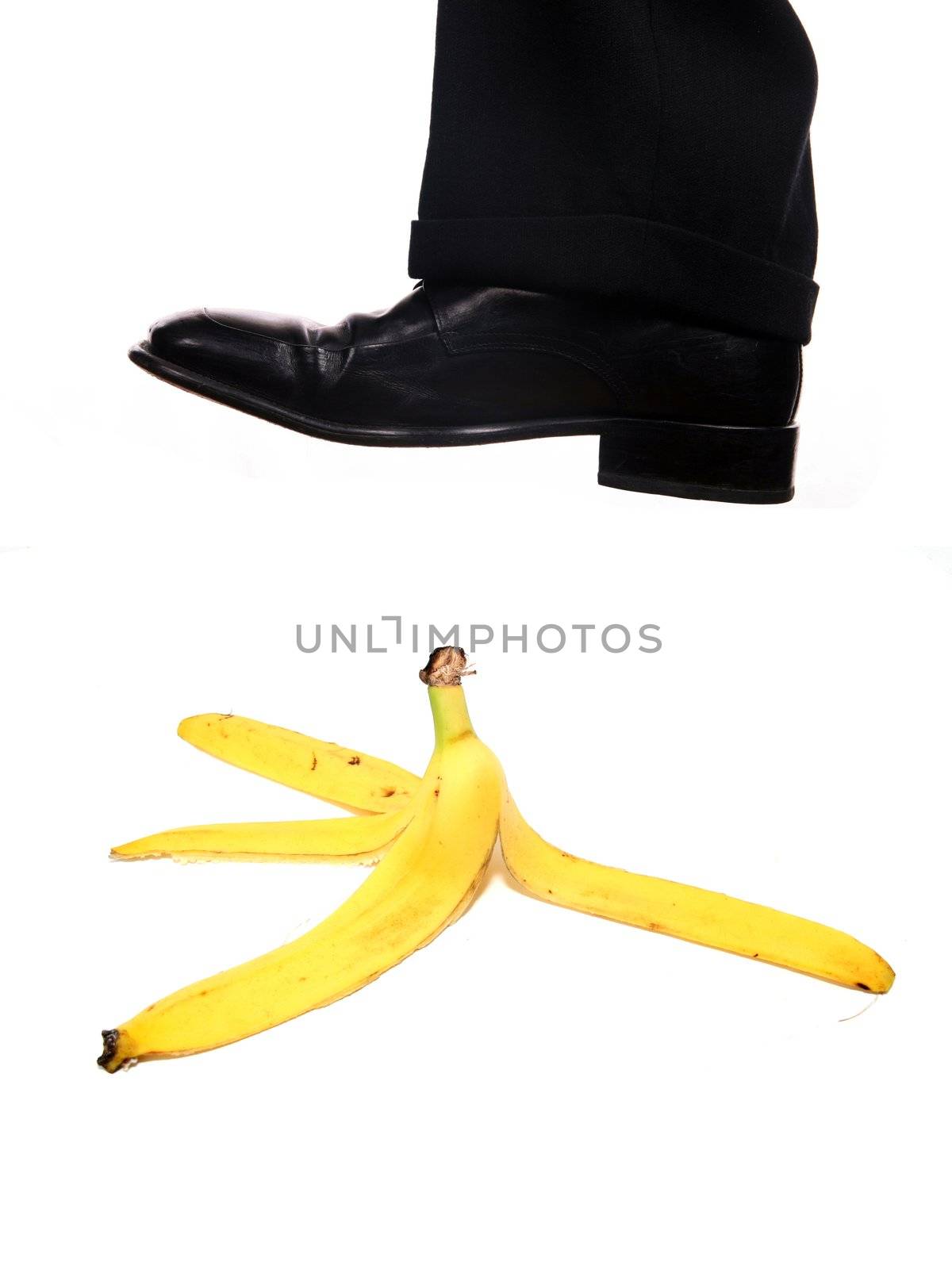 businessman shoe steping a banana