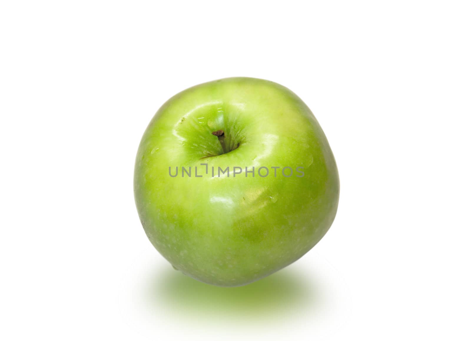 Juicy and ripe green apple closeup on a white background.